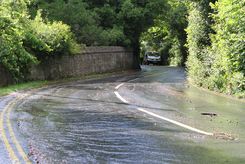 POLICE SHUT FLOODED PUCKPOOL HILL