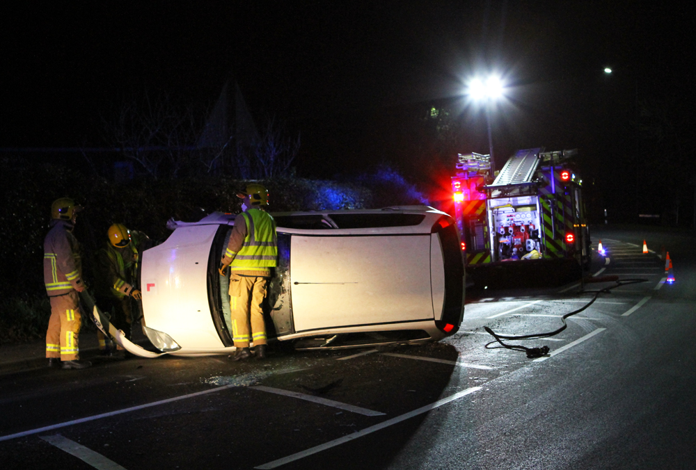 CAR OVERTURNS ON BINSTEAD MAIN ROAD