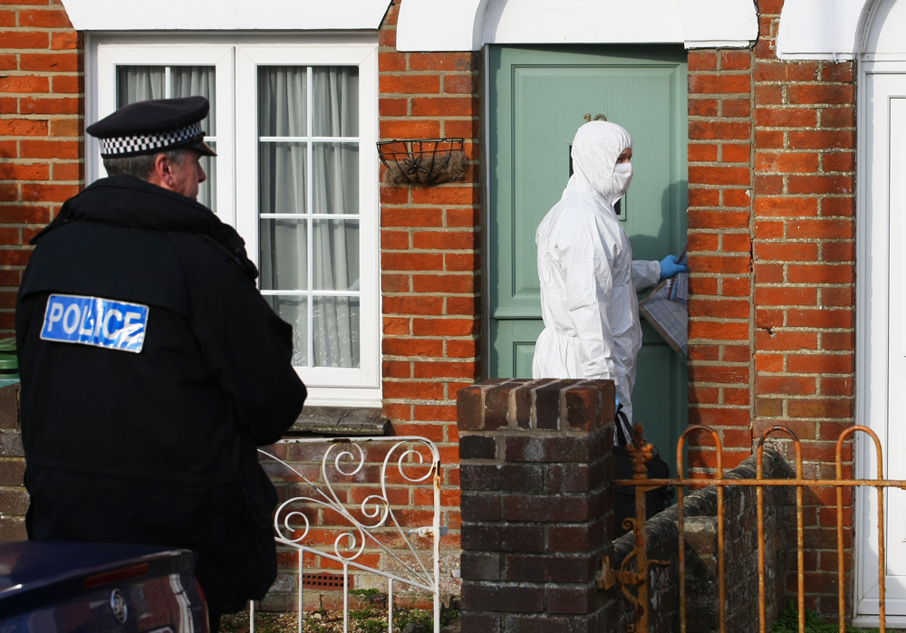 FORENSIC TEAMS ARRIVE AT GURNARD HOME