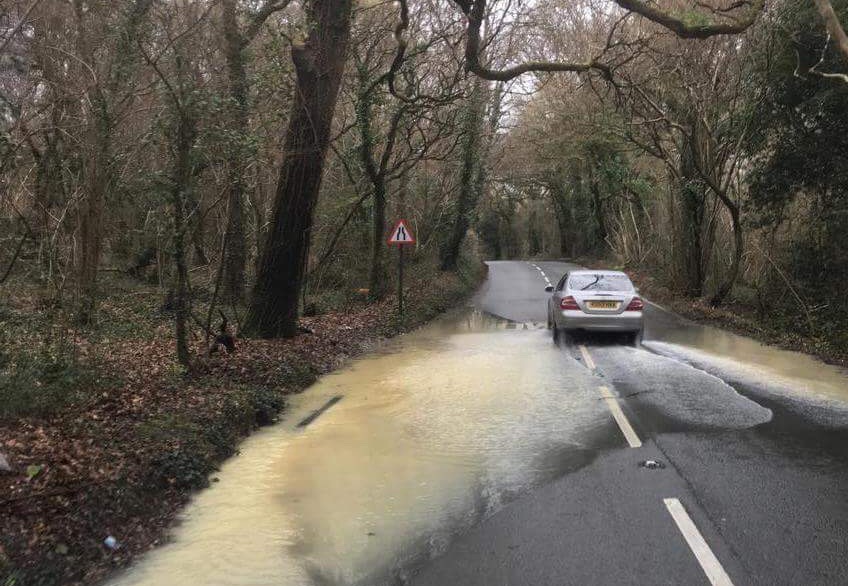BURST WATER MAIN LEADS TO ROAD FLOODING