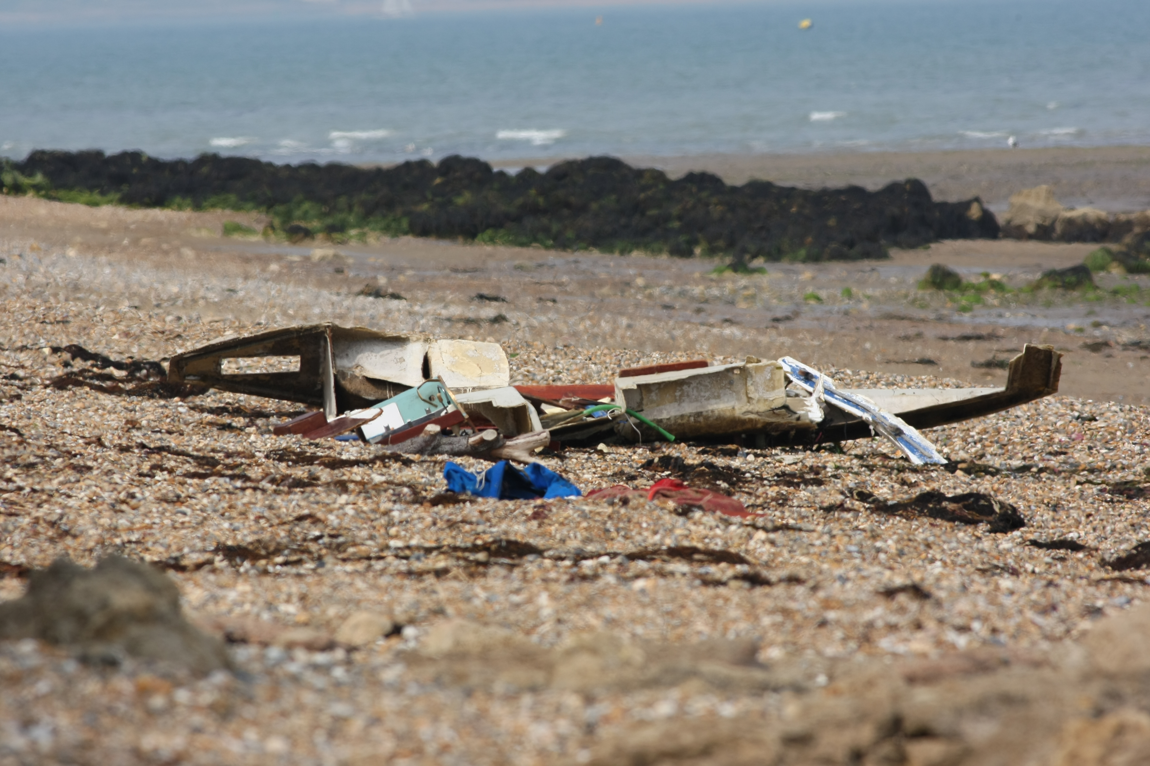 YACHT DEBRIS WASHES UP ON THE SHORE