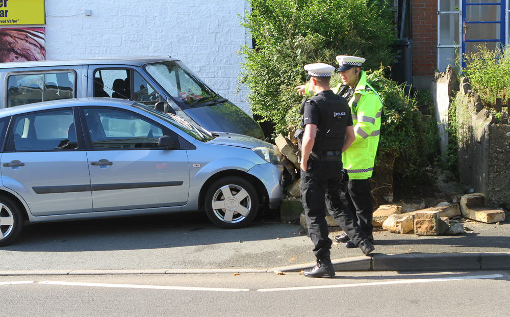 CAR CRASHES INTO WALL IN LAKE