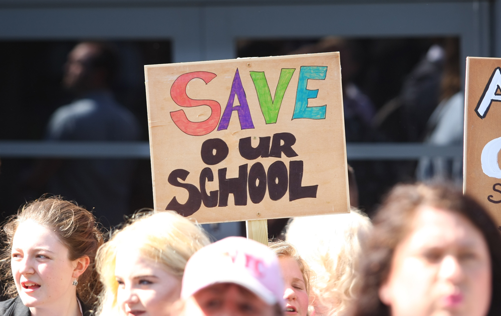 HUNDREDS ATTEND PROTEST AGAINST PROPOSED ACADEMY MERGER