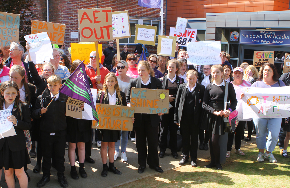 HUNDREDS ATTEND PROTEST AGAINST PROPOSED ACADEMY MERGER