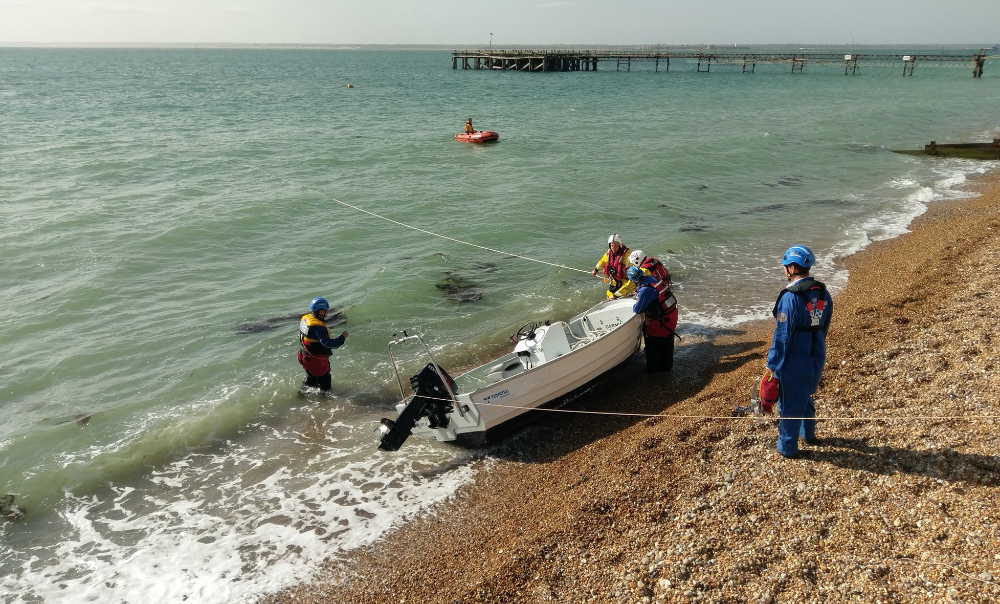 RNLI AND COASTGUARD INVESTIGATE BOAT ASHORE AT TOTLAND