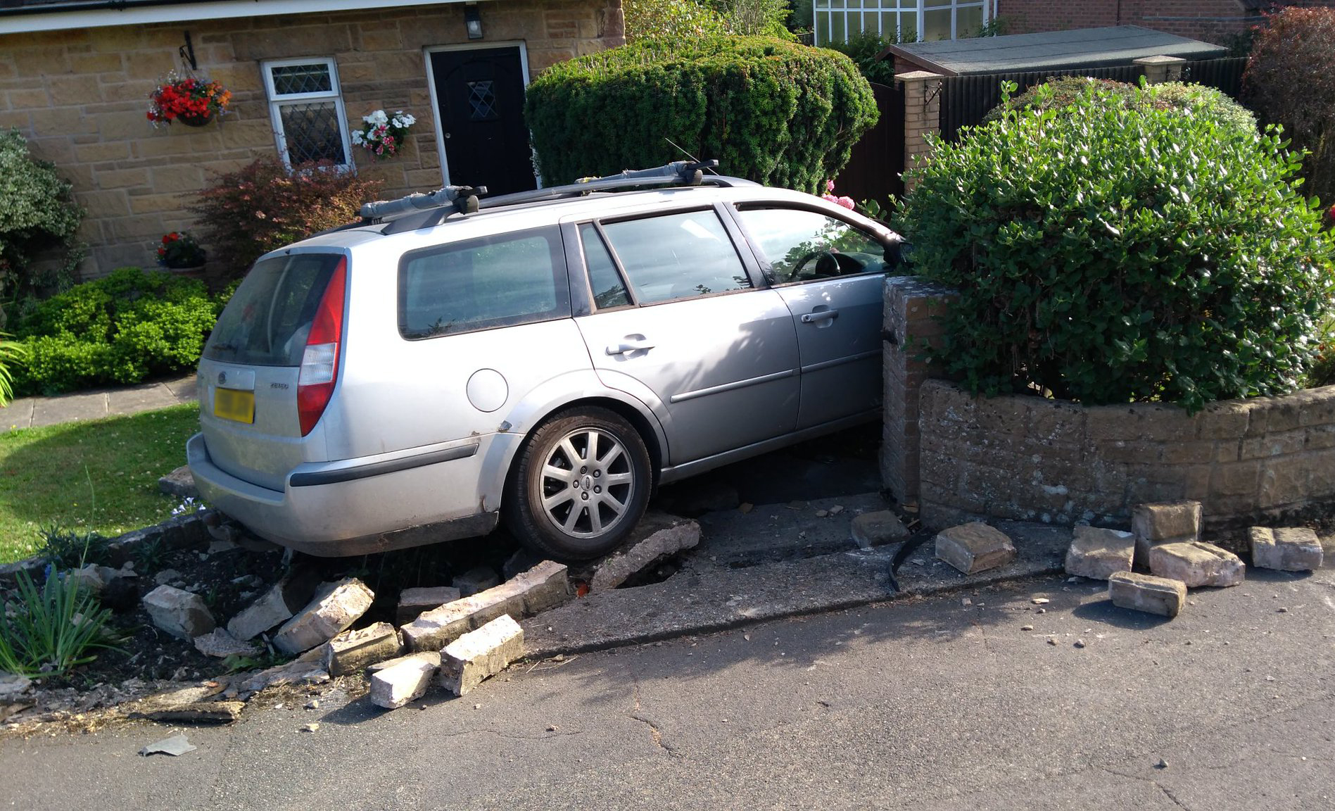 CAR ROLLS INTO GARDEN WALL IN GURNARD