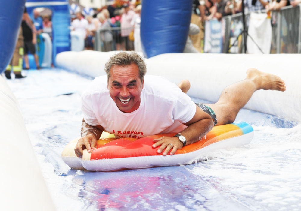 TRIUMPHANT DAY FOR SELL-OUT RYDE SLIDE FUNDRAISER