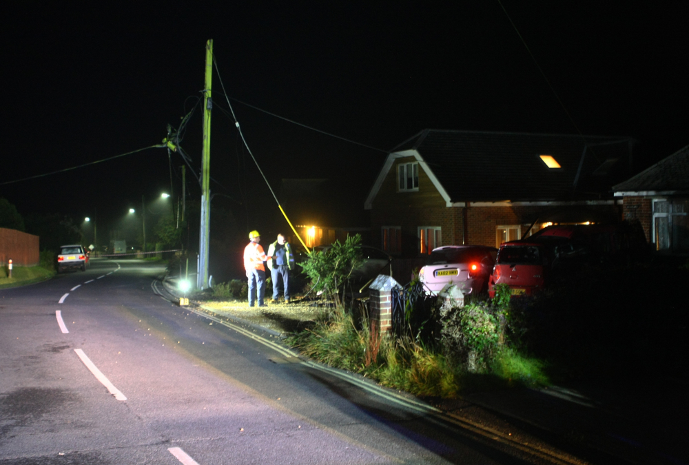 CAR BRINGS DOWN POWER LINE AND DAMAGES HOUSE IN COWES