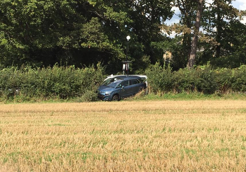 CAR CRASHES THROUGH HEDGE IN BINSTEAD