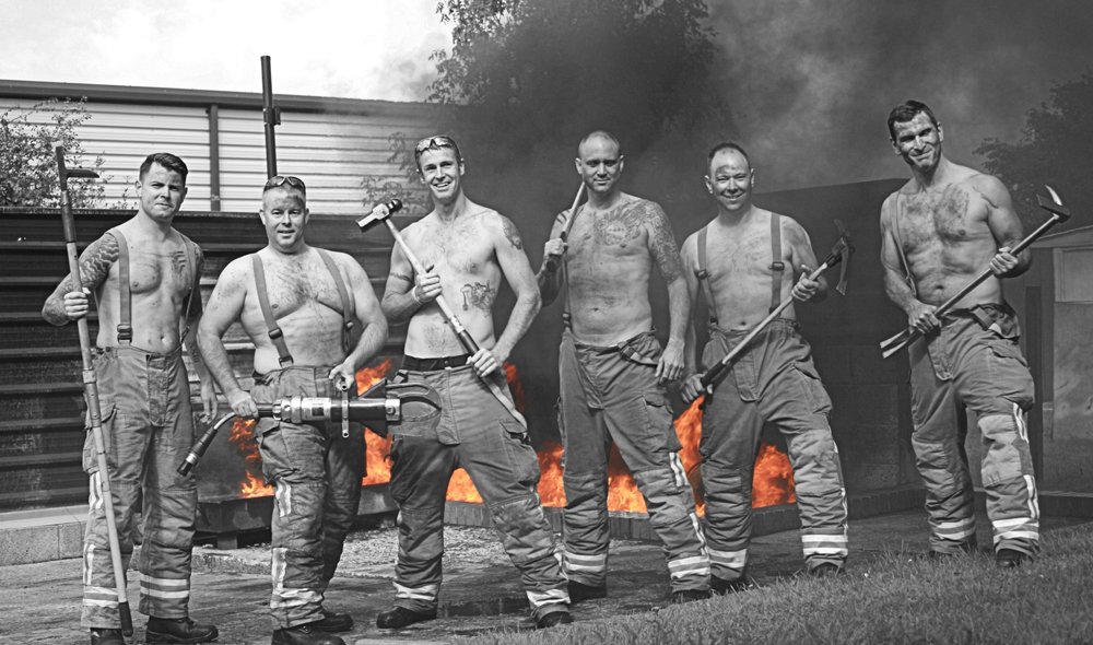 FIREFIGHTERS GET OUT THEIR HOSES AND HELMETS FOR CHARITY CALENDAR