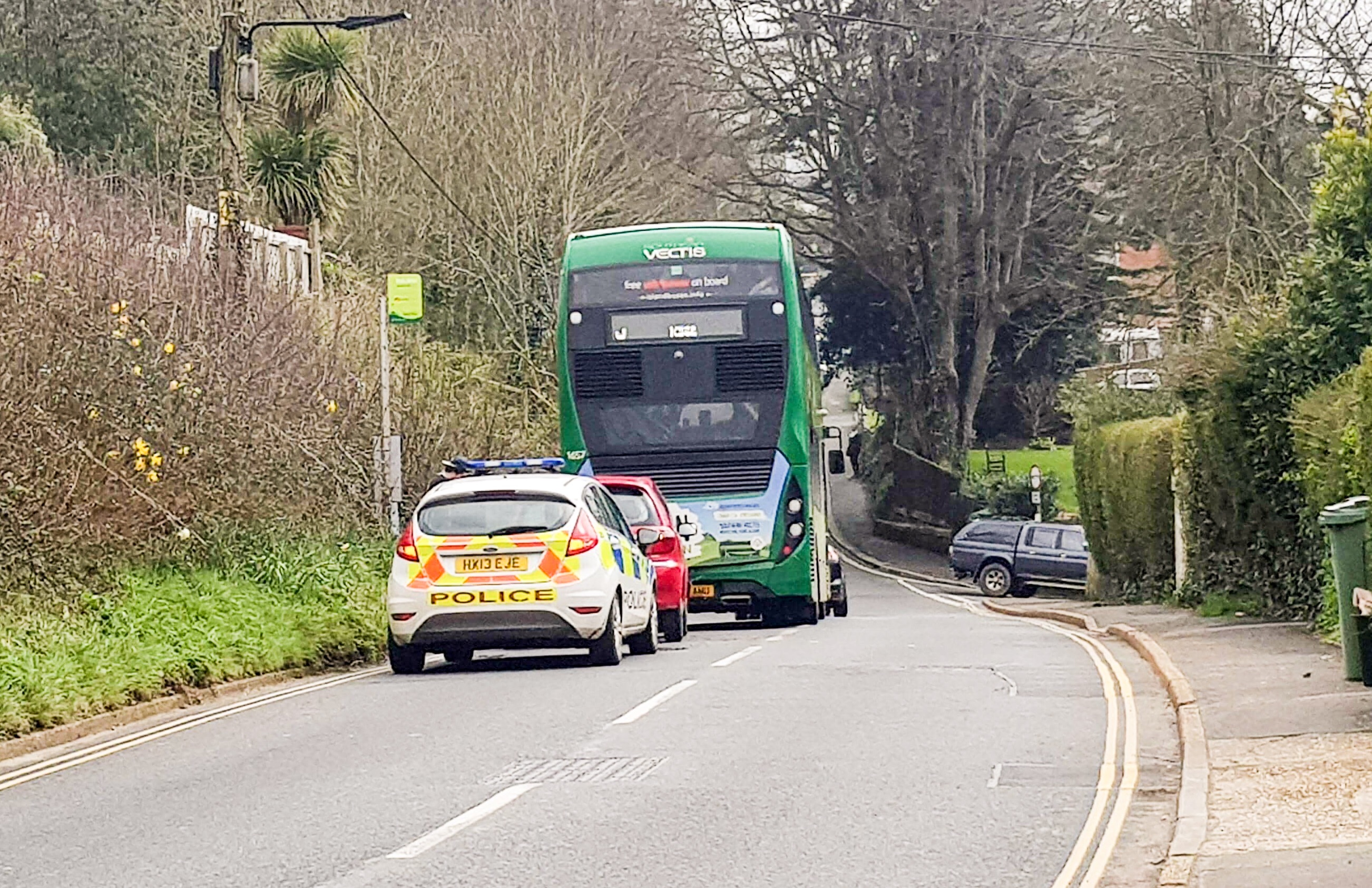 CAR CRASHES INTO BUS CARRYING SCHOOL CHILDREN