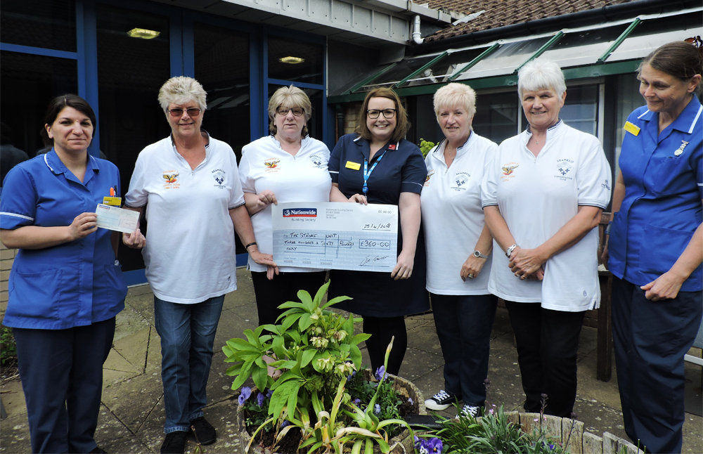 LADIES DARTS TEAM SUPPORT STROKE UNIT IN MEMORY OF DEAR FRIEND