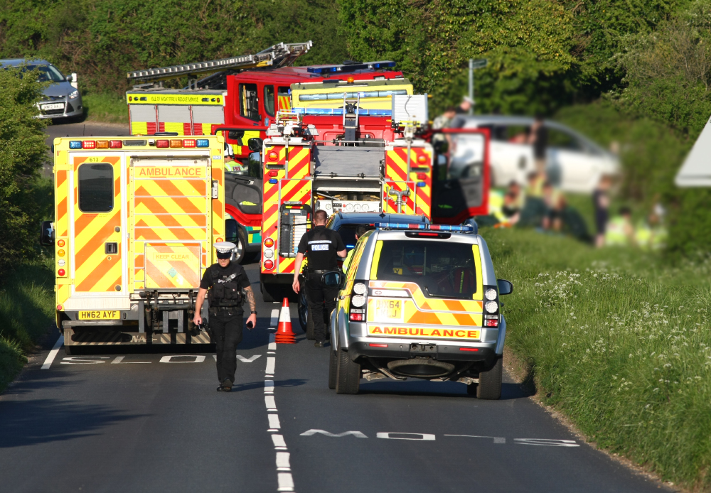PERSONS TRAPPED IN DOWNS ROAD MOTORCYCLE CRASH