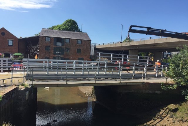 TEMPORARY BRIDGE ACROSS THE RIVER AHEAD OF FESTIVAL WEEKEND