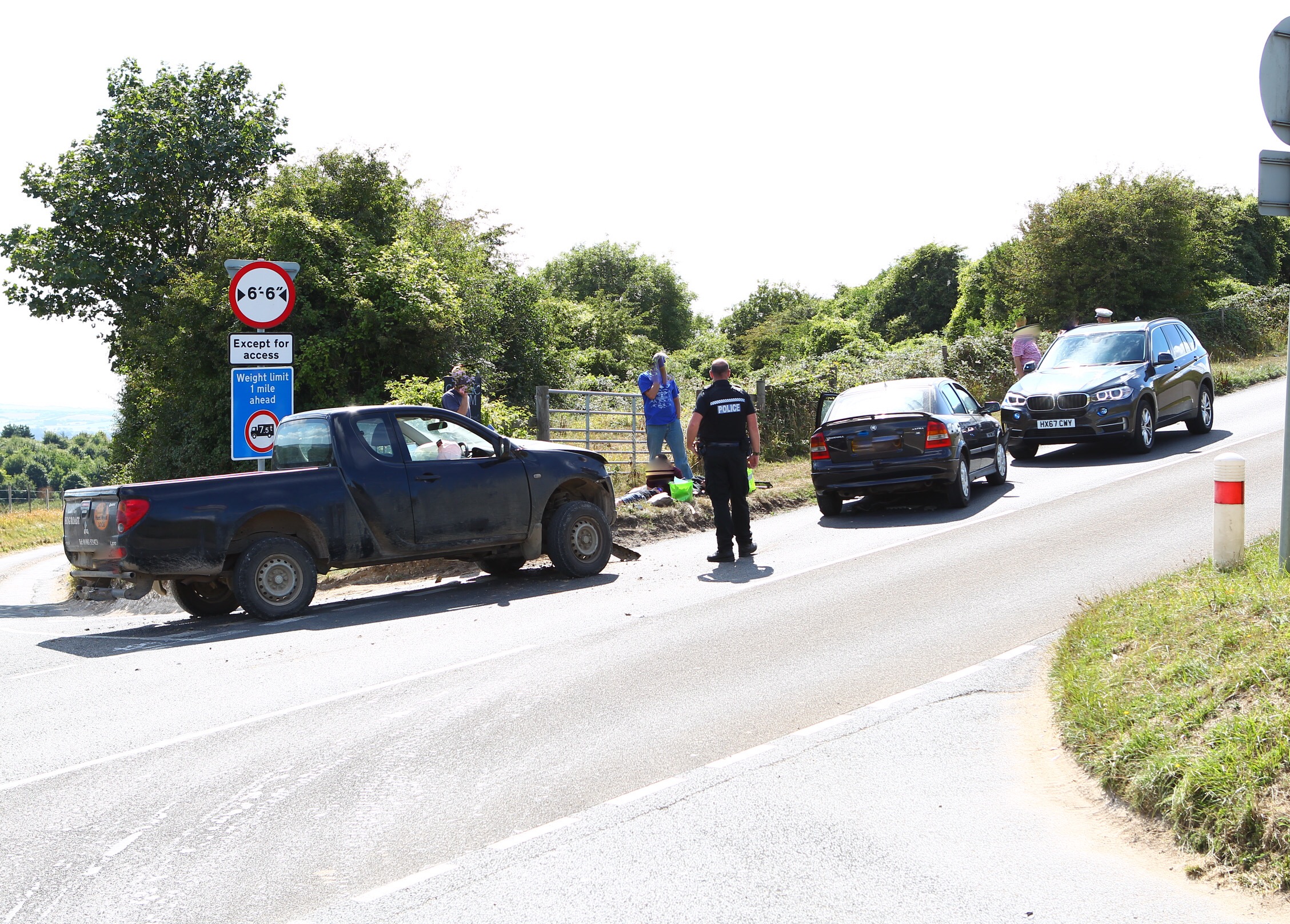 PICK-UP AND CAR COLLIDE ON THE DOWNS