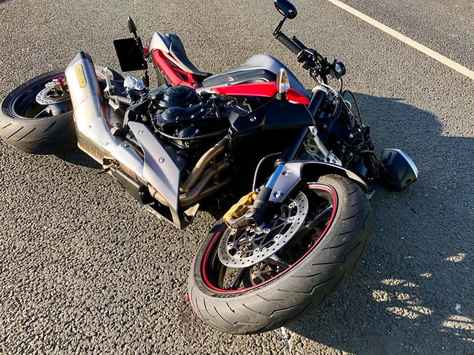 MOTORCYCLE AND CAR IN MILITARY ROAD COLLISION