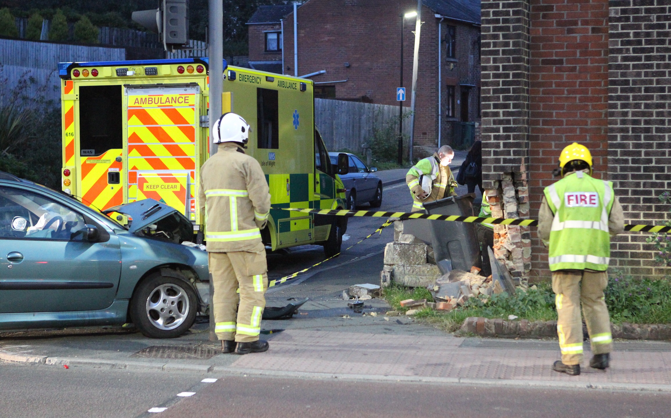 CAR CRASHES INTO HOUSE AND WIPES OUT TRAFFIC LIGHTS ON COPPINS BRIDGE