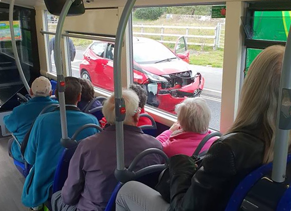 CAR CRASHES INTO BUS NEAR ASDA
