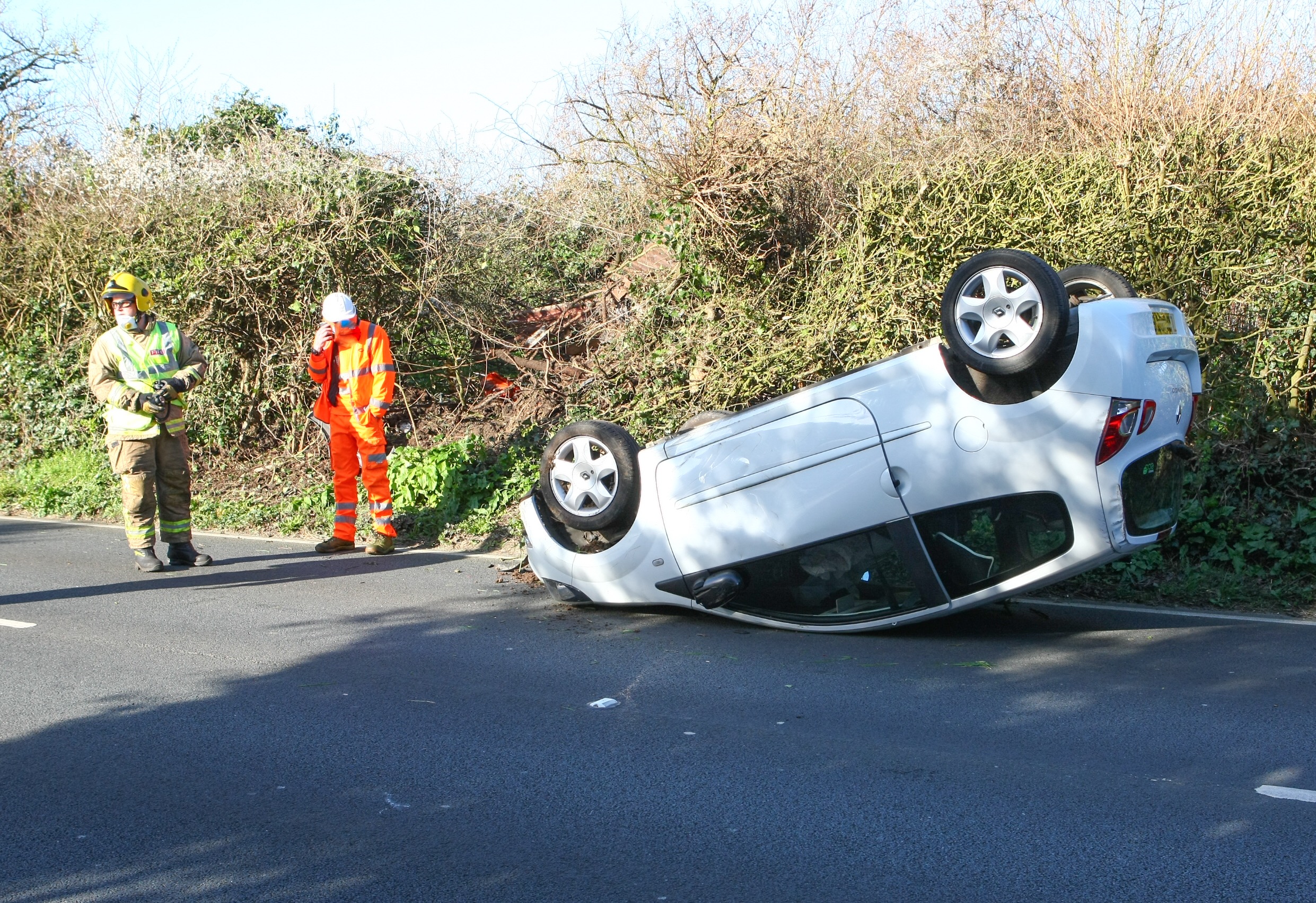 CAR ROLLS ONTO ROOF AT BRADING