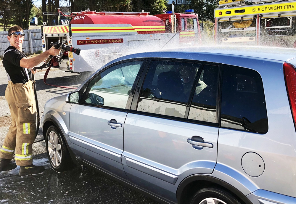 FIREFIGHTERS PRIME THEIR HOSES FOR CHARITY CAR WASH IN FRESHWATER