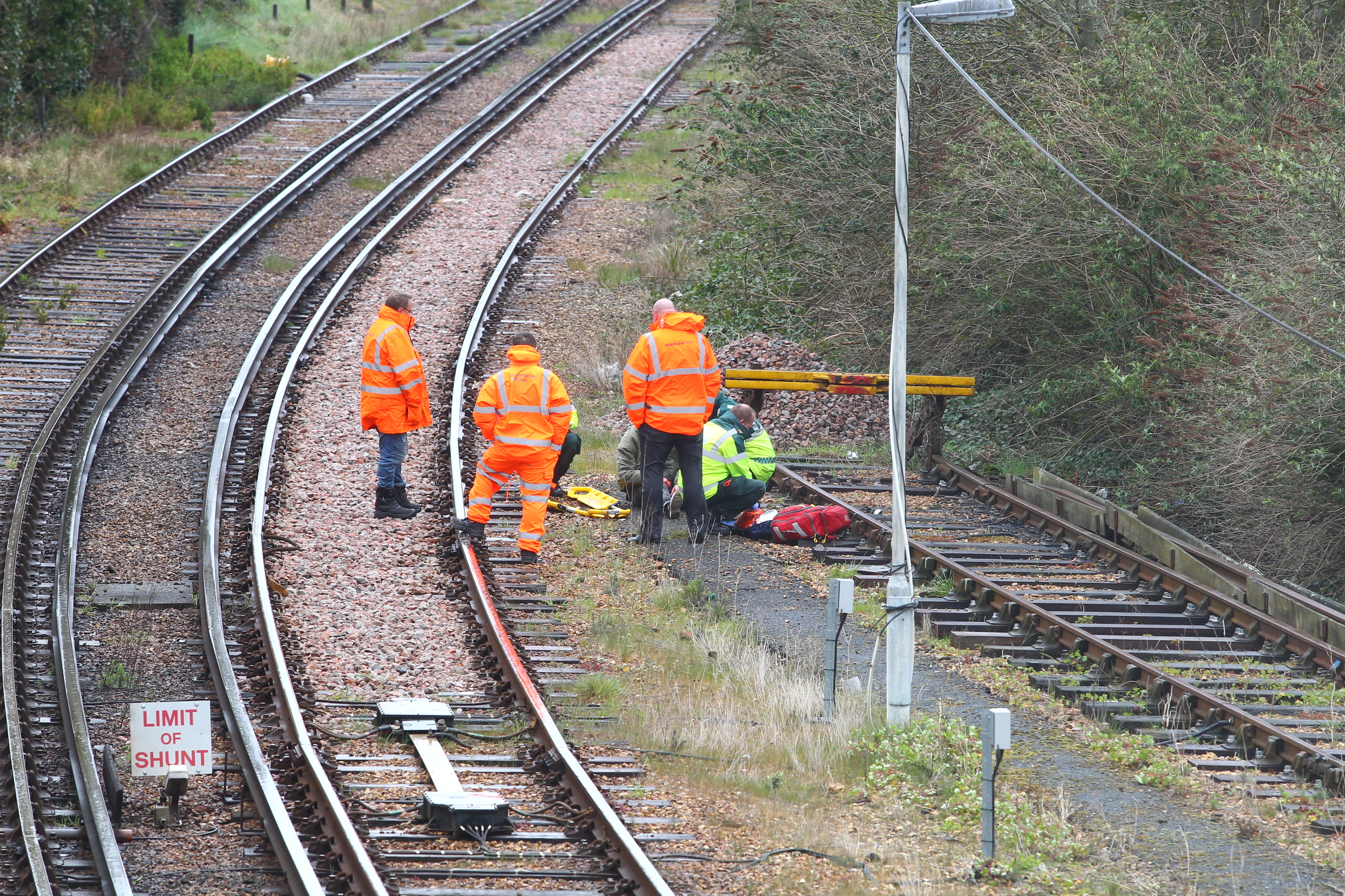TRAINS HALTED AS PERSON FOUND BESIDE TRACK