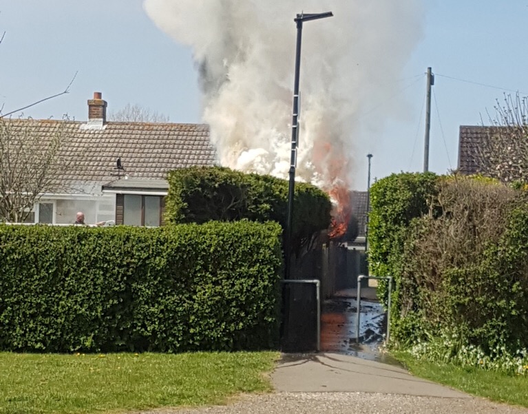 HEDGE FIRE THREATENS PROPERTY IN NEWPORT