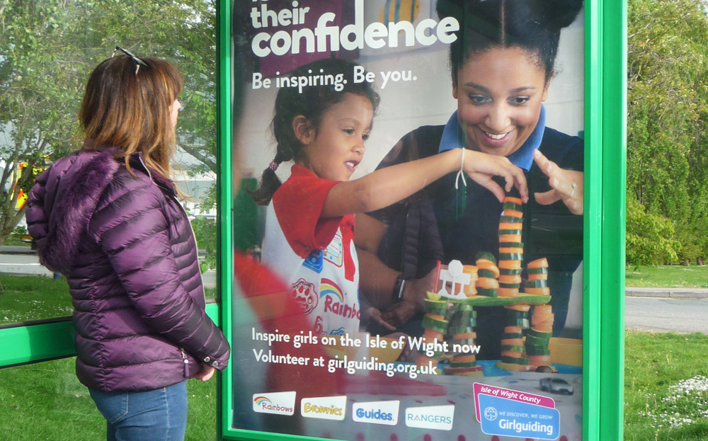 GIRLGUIDING MEMBERS FIND HOMES IN BUS SHELTERS.