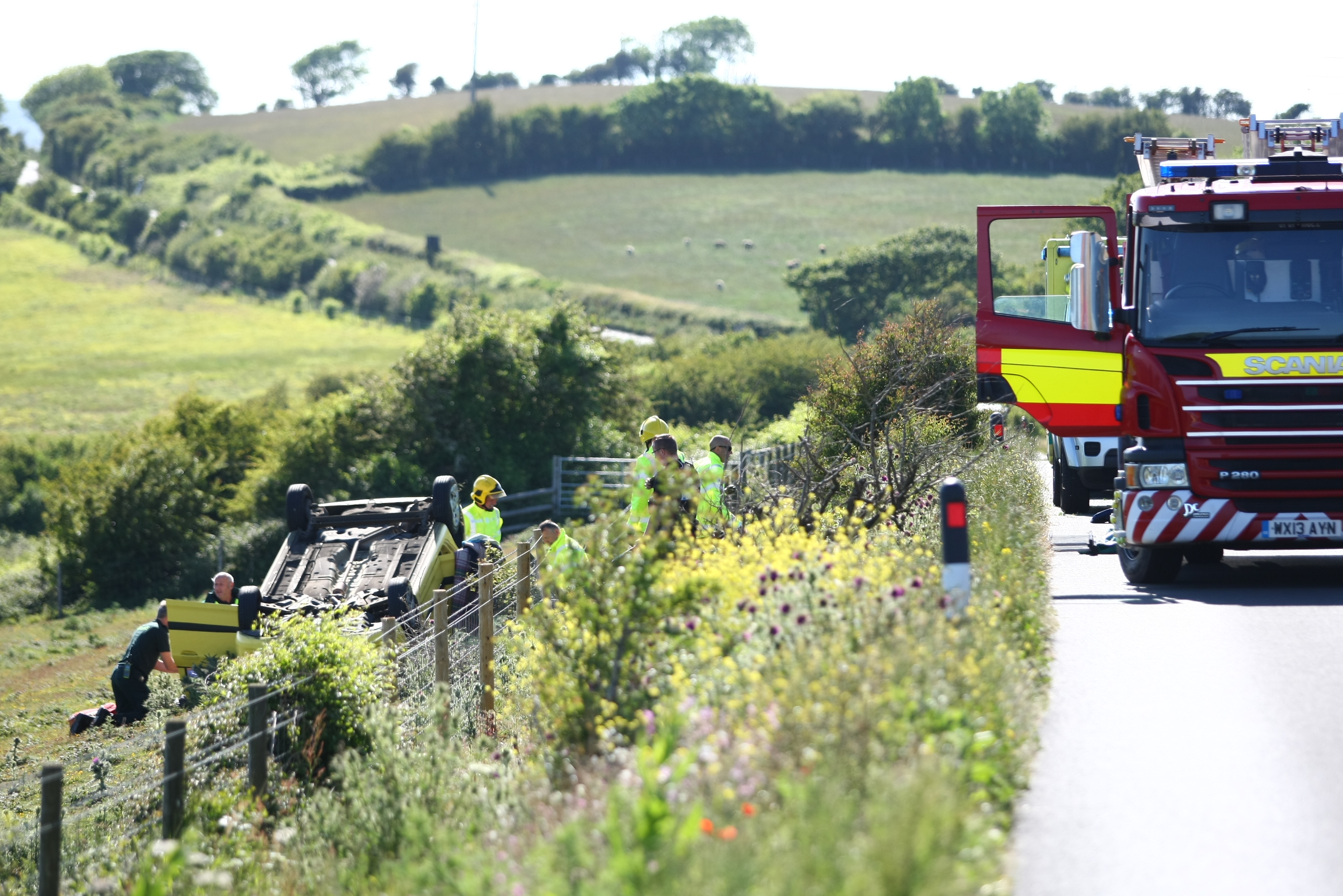 CAR ROLLS ONTO ROOF IN FIELD ON THE DOWNS
