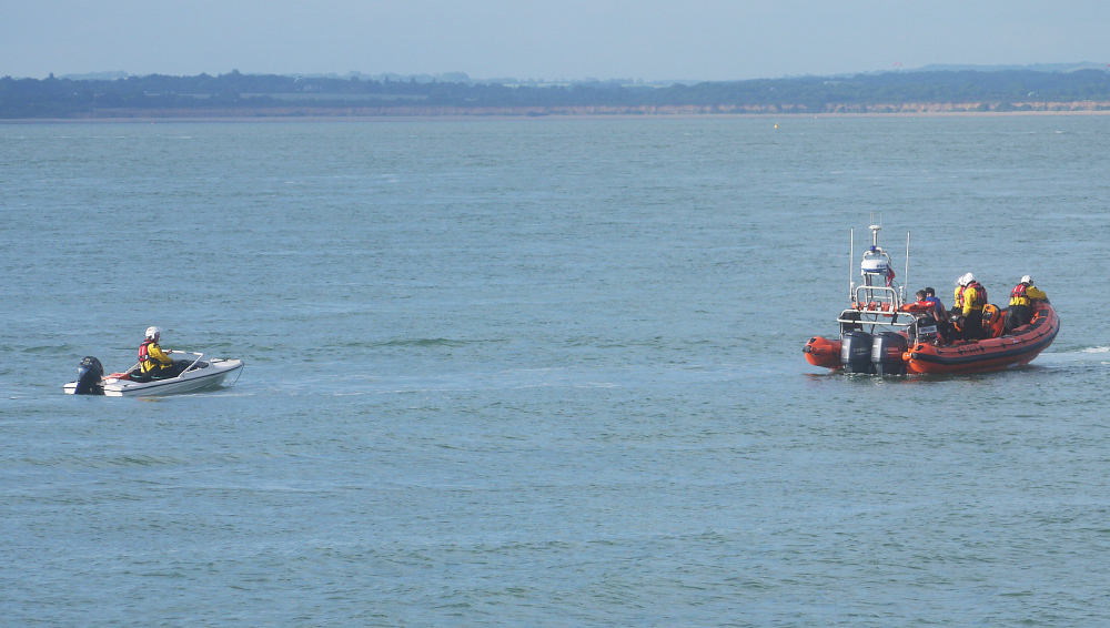 CRIPPLED AND WATERLOGGED SPEEDBOAT TOWED TO SAFETY