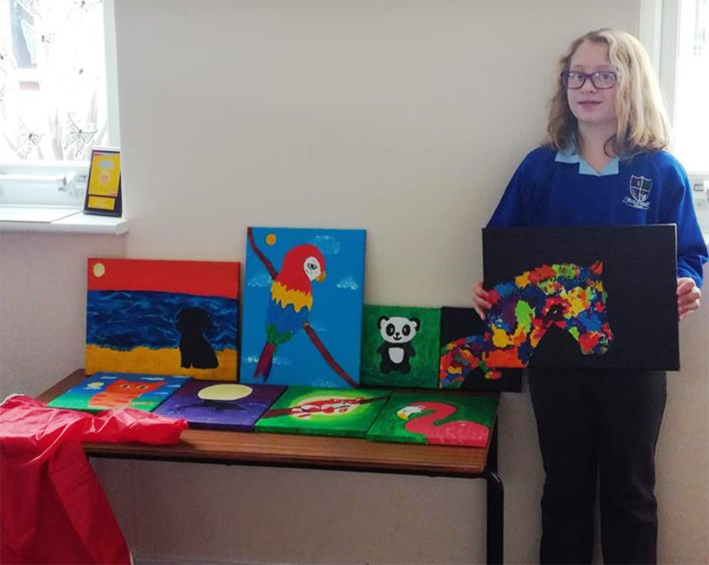 YOUNG PAINTER LILLIAN RAISES FUNDS FOR CLASSMATES’ APRONS