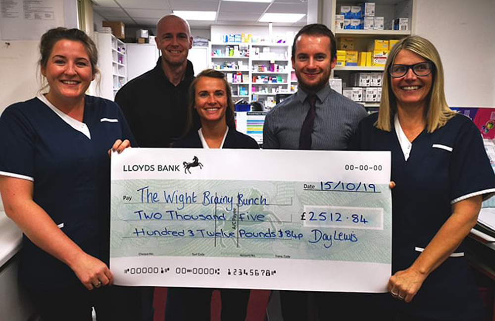 DAY LEWIS STAFF IN CARISBROOKE RAISE MONEY FOR WIGHT BRAINY BUNCH