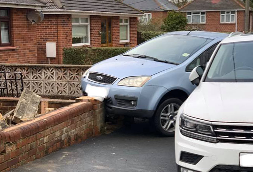 SCHOOL RUN DRAMA AS CAR CRASHES INTO WALL IN NEWPORT