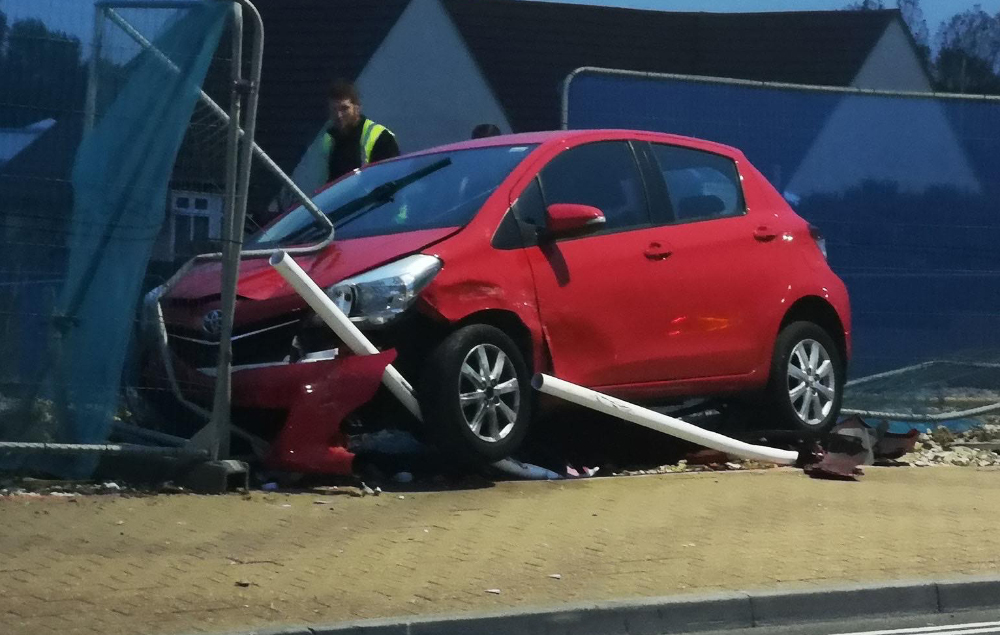 CAR CAREERS INTO BUILDING SITE FENCING IN SANDOWN