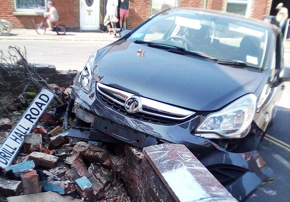 WOMAN CRASHES THROUGH GARDEN WALL AFTER ‘SUFFERING CRAMP’