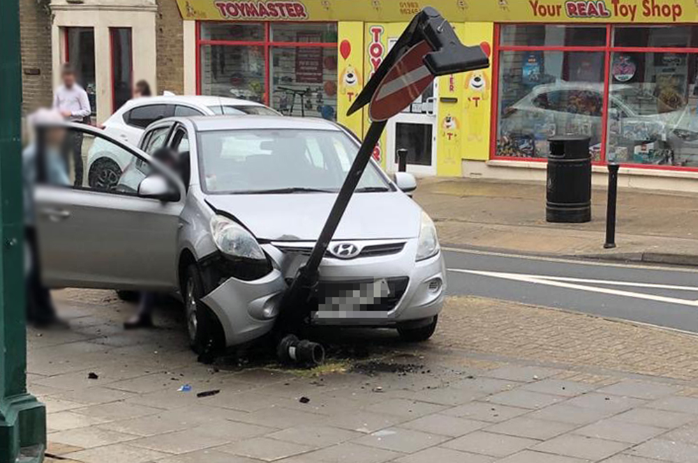 STREET FURNITURE WIPED OUT AFTER DRIVER HITS THE THROTTLE