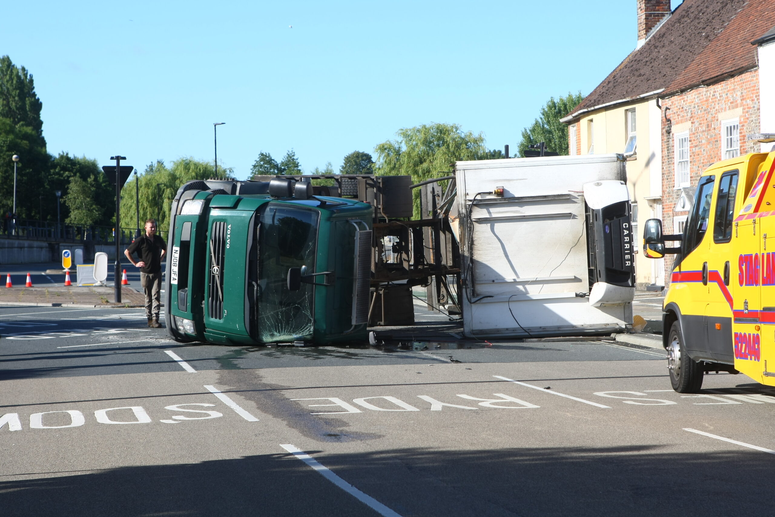 BACON ROLL-OVER: MEAT LORRY OVERTURNS ON COPPINS BRIDGE