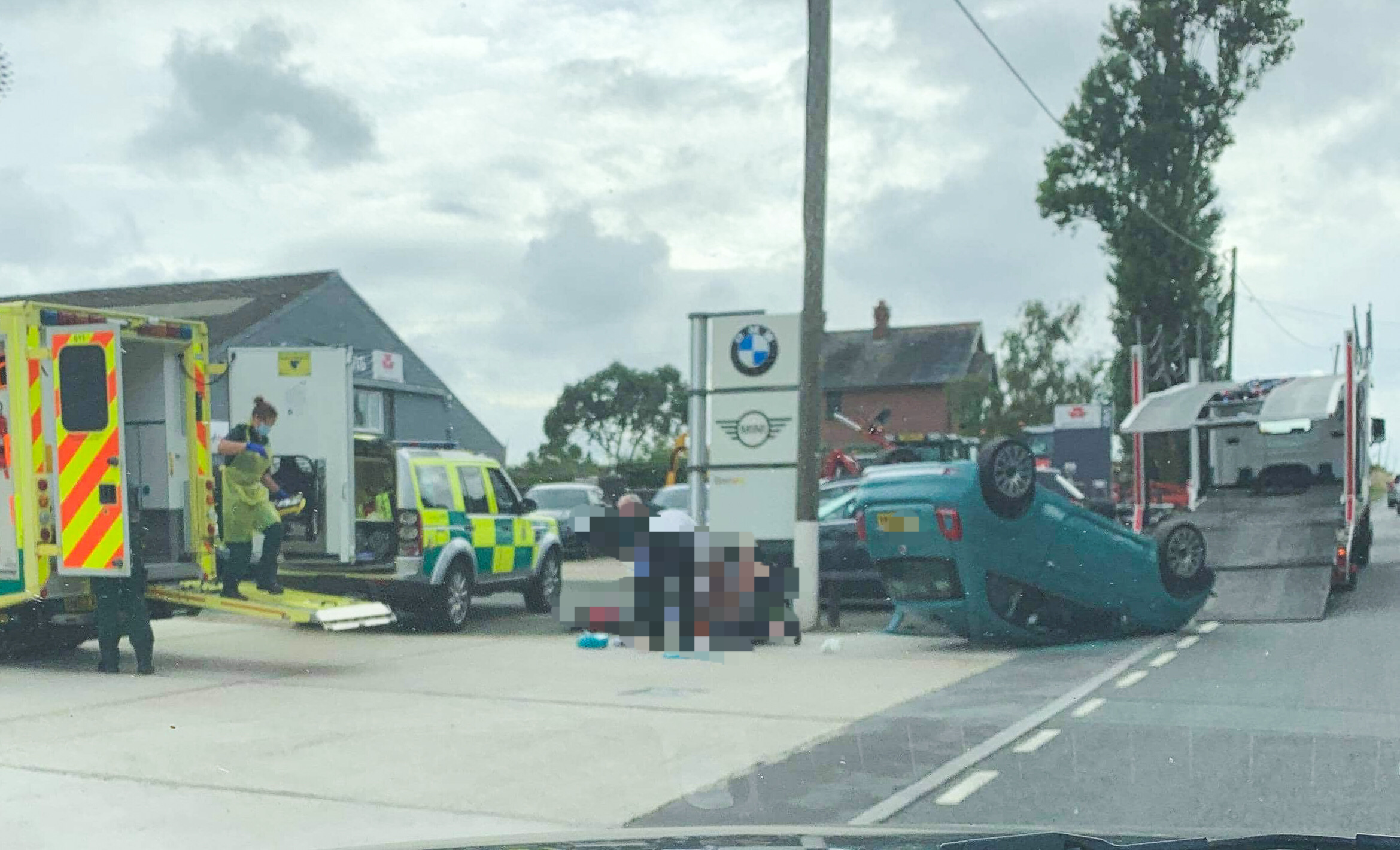 CAR LANDS ON ROOF AFTER COMING OFF TRANSPORTER