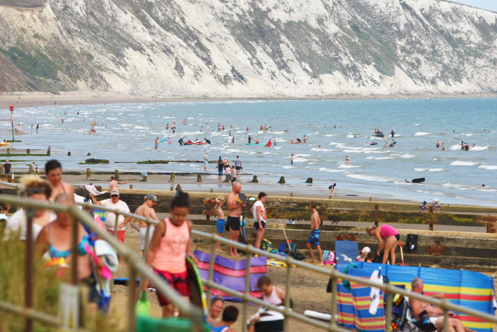 HOTTEST DAY OF THE YEAR SEES CROWDS FLOCK TO THE BEACH