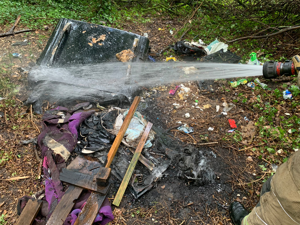 FIREFIGHTERS DOUSE 2M X 2M FIRE IN THE WOODS IN RYDE