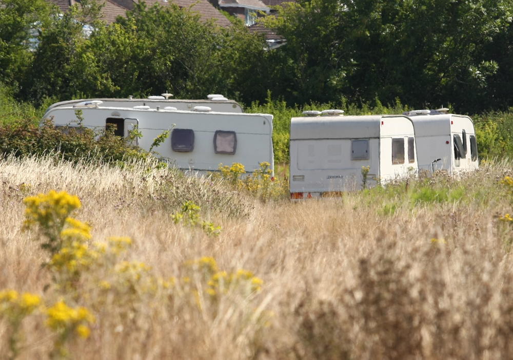 TRAVELLERS SET UP HOME IN A FIELD IN RYDE