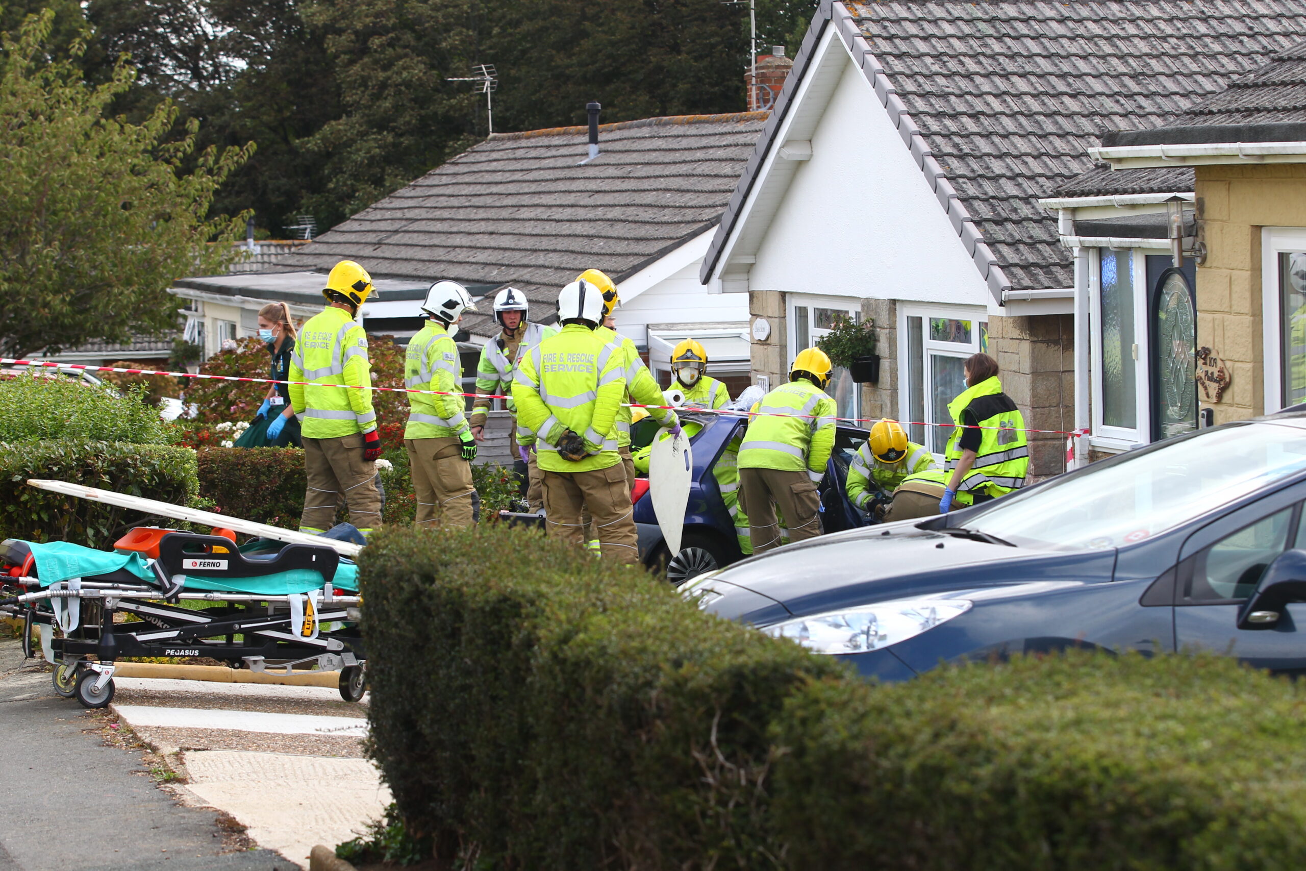 2 TRAPPED AS CAR CRASHES INTO BUILDING IN SHANKLIN