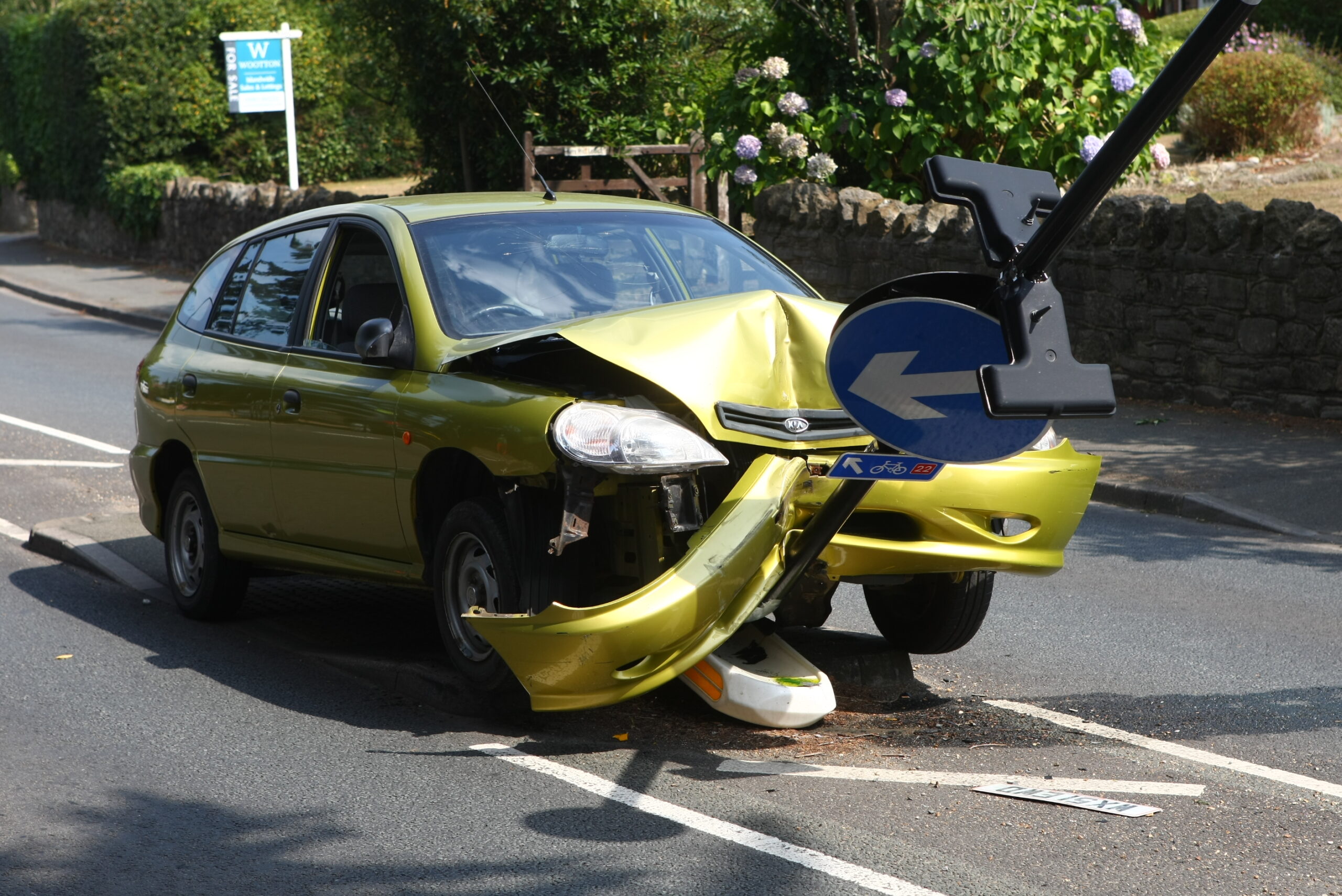 CAR CRASHES HEAD-ON INTO TRAFFIC ISLAND DUE TO SPIDER