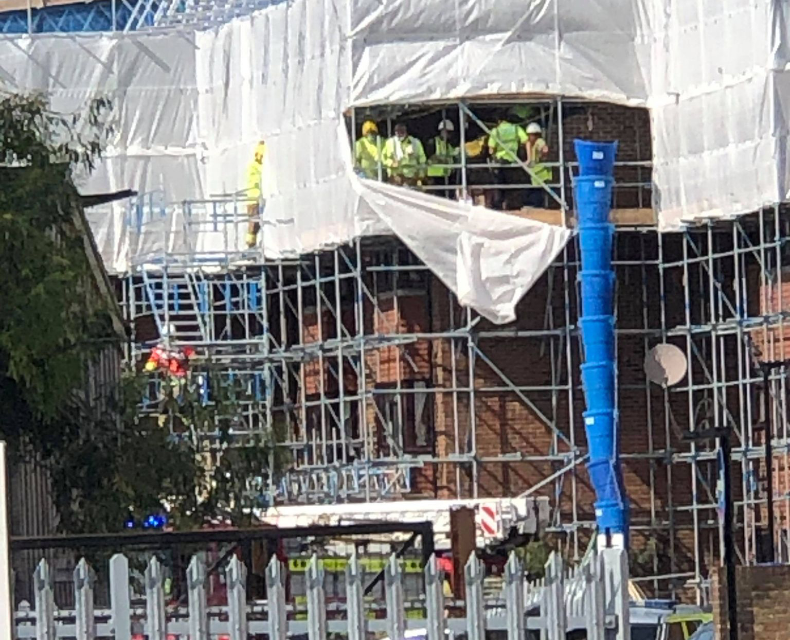 WORKMAN WEARING HARNESS RESCUED AFTER ROOF FALL