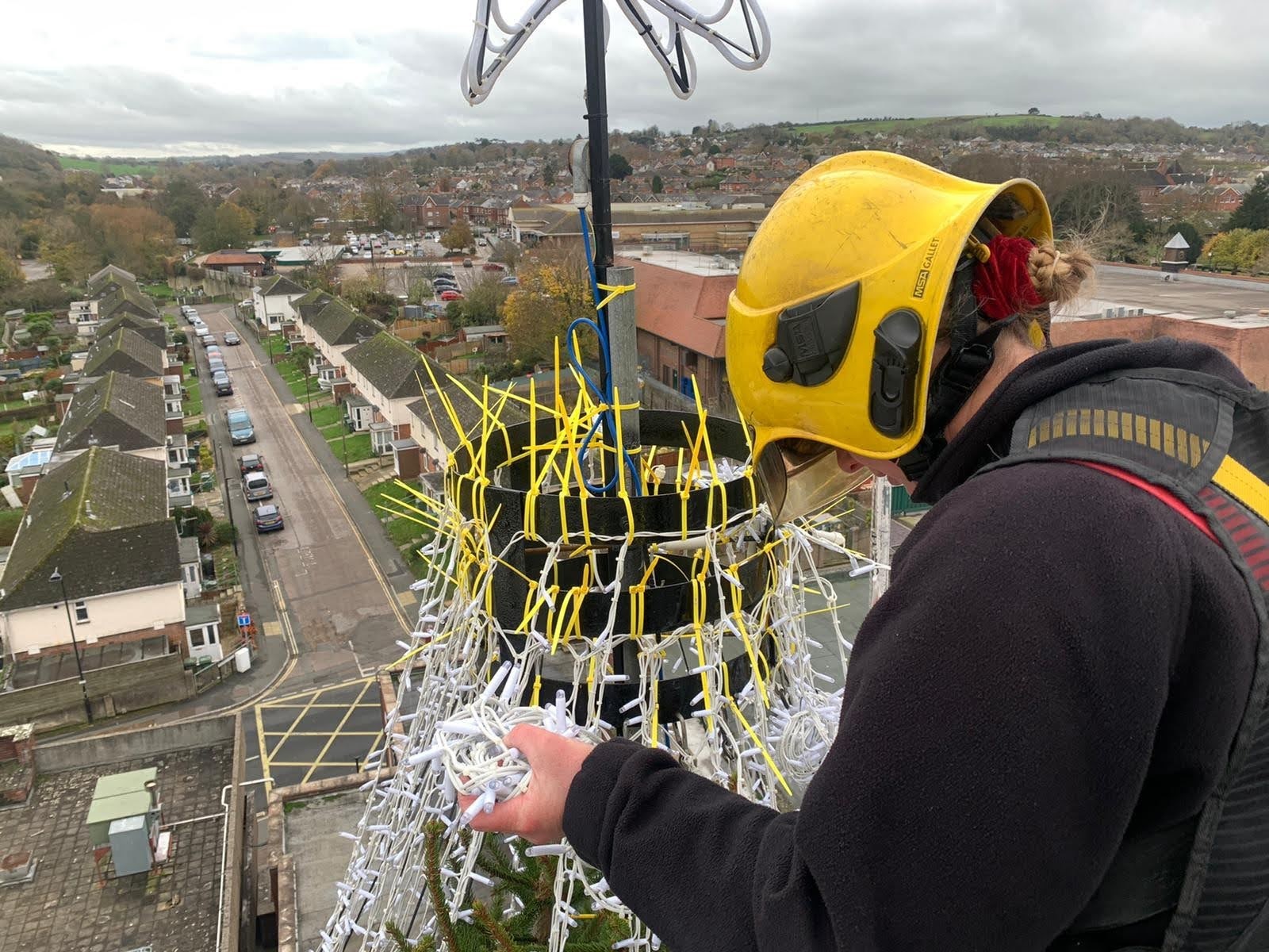 NEWPORT’S CHRISTMAS TREE LOFTED ATOP OF THE TOWN’S FIRE STATION