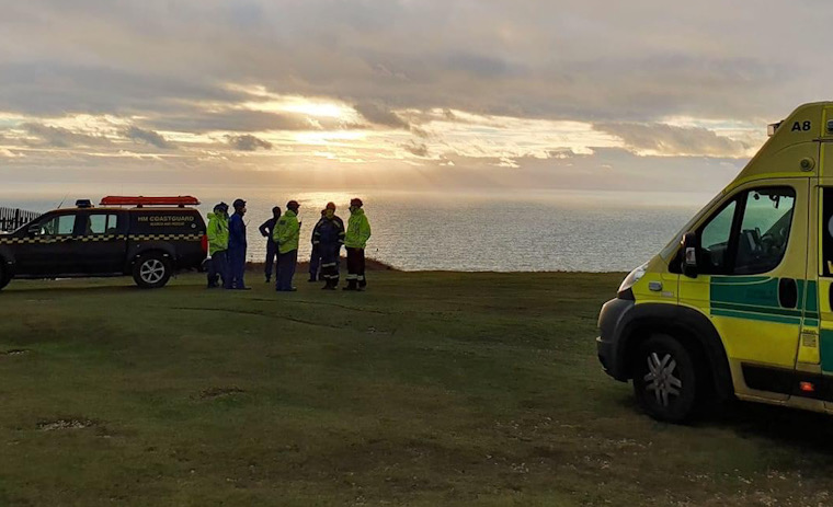 CASUALTY STRETCHERED TO AWAITING AMBULANCE BY COASTGUARD AT TENNYSON DOWN