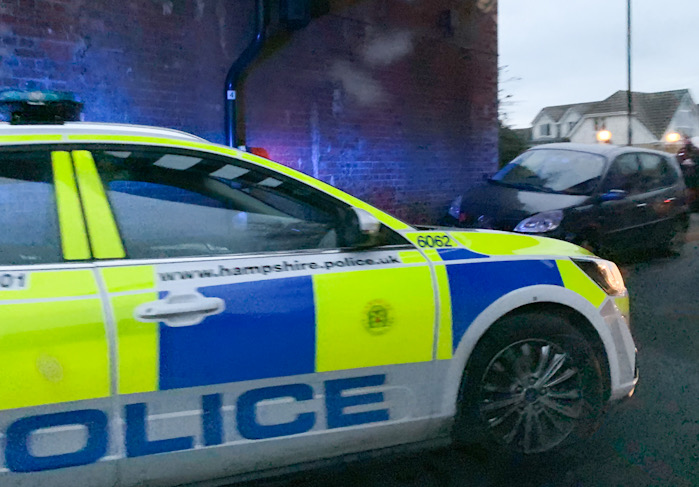 PARAMEDICS TEND TO MALE DRIVER AFTER CAR COLLIDES WITH BRIDGE