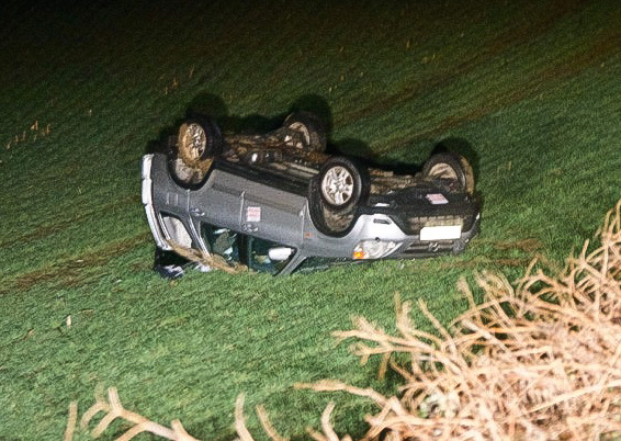 CAR ON ITS ROOF AFTER CRASHING INTO FIELD AT BLACKWATER