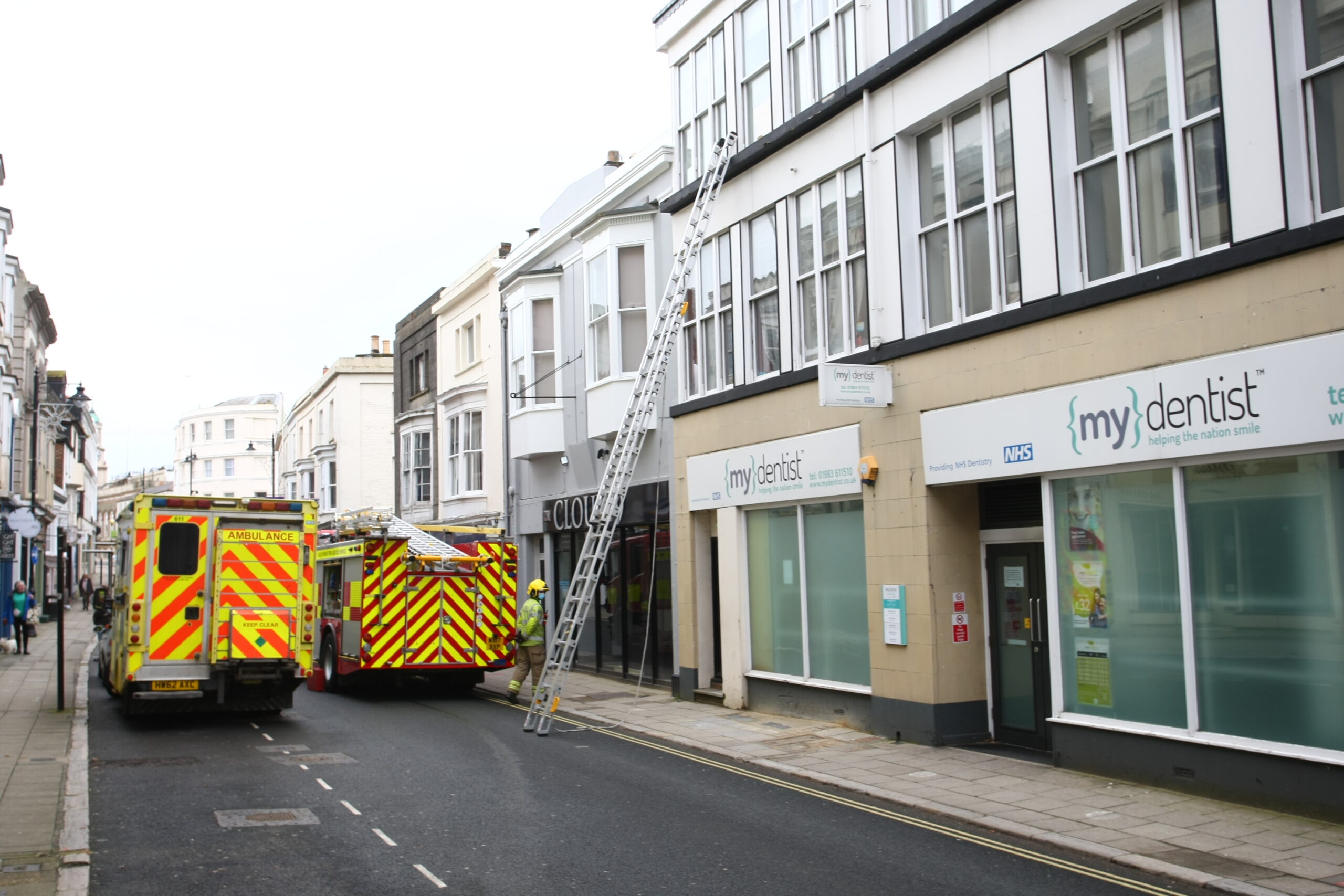 CROSS STREET CLOSED AS FIREFIGHTERS GAIN ENTRY TO FLAT