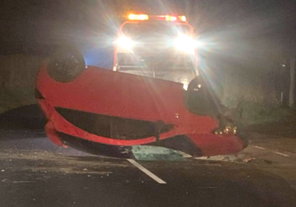 CAR ON ROOF CLOSES ROAD BETWEEN GODSHILL AND WHITWELL