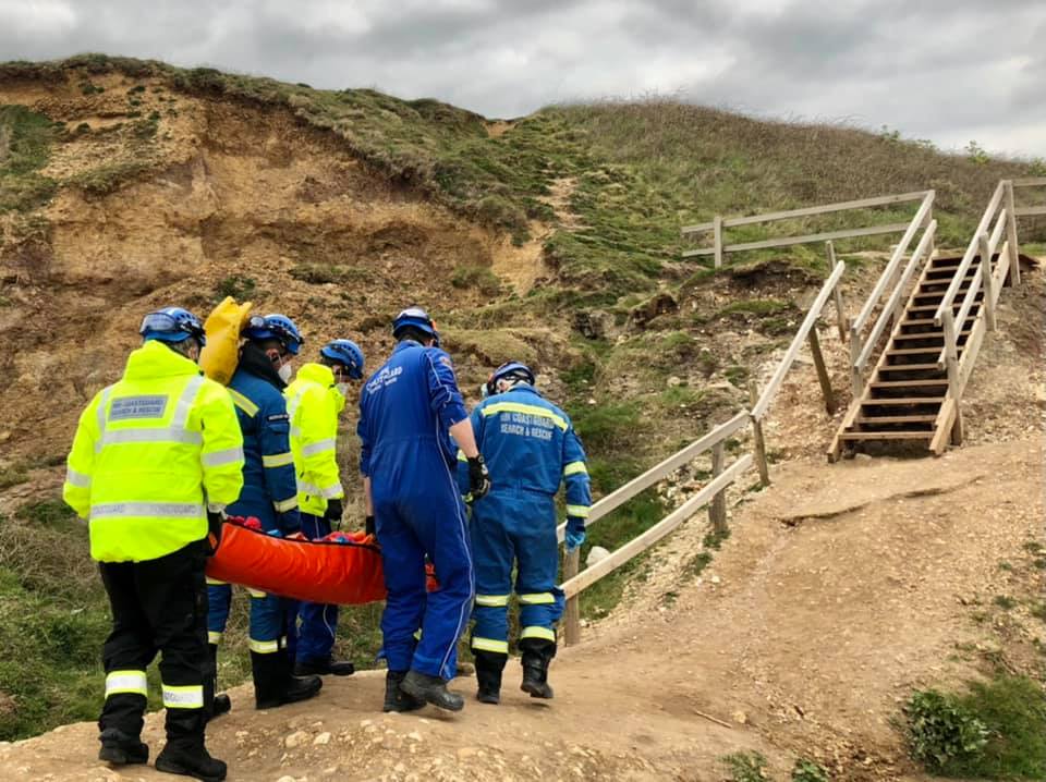 INJURED MALE STRETCHERED FROM THE BEACH NEAR COMPTON